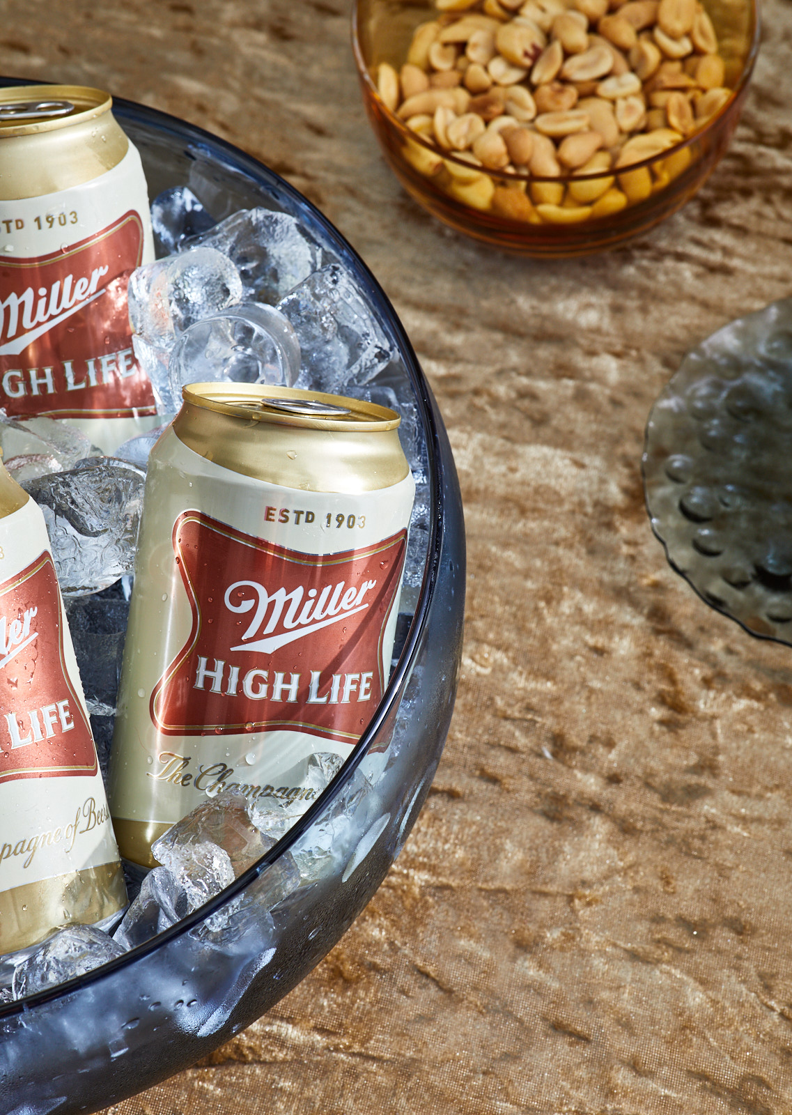 Miller High Life beer cans in blue bowl