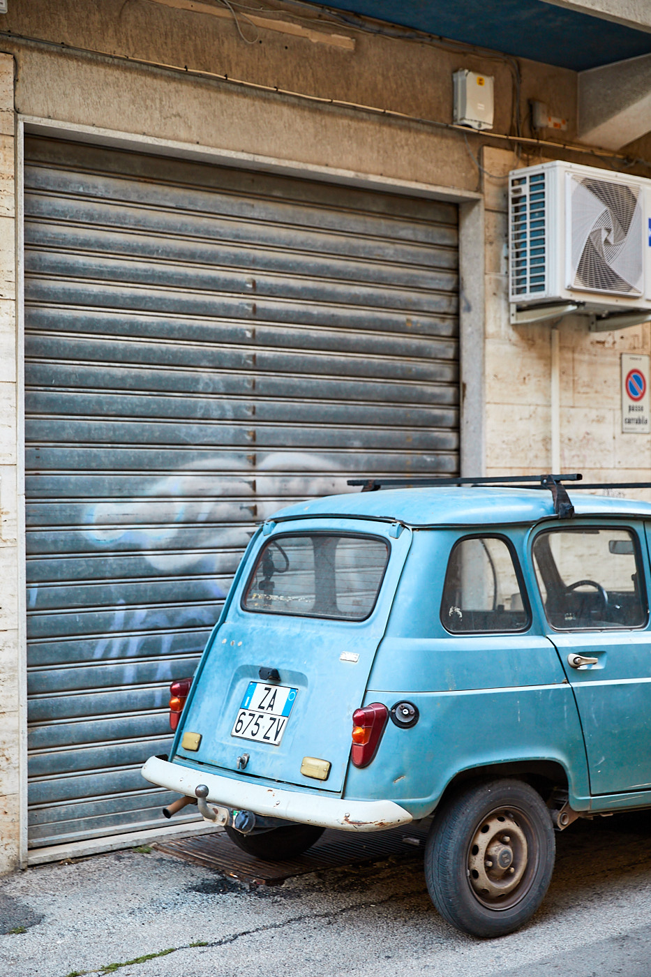 Blue Fiat in Alleyway