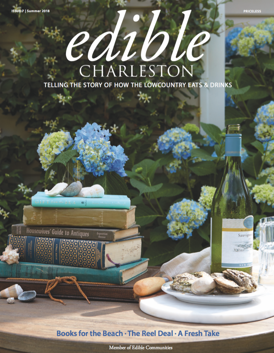 Books Oysters and wine on outdoor patio with hydrangeas