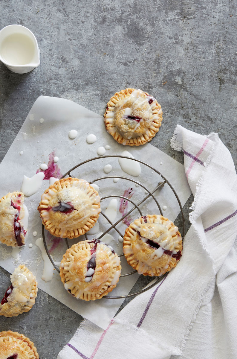 Blueberry Iced hand pies on a wire rack