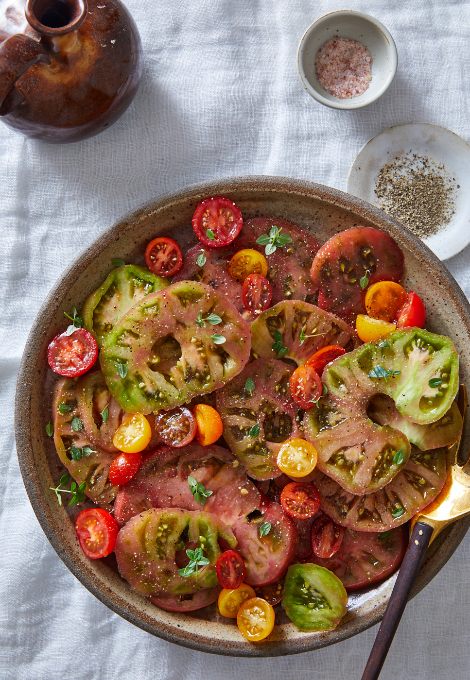 Heirloom tomato salad on table with olive oil