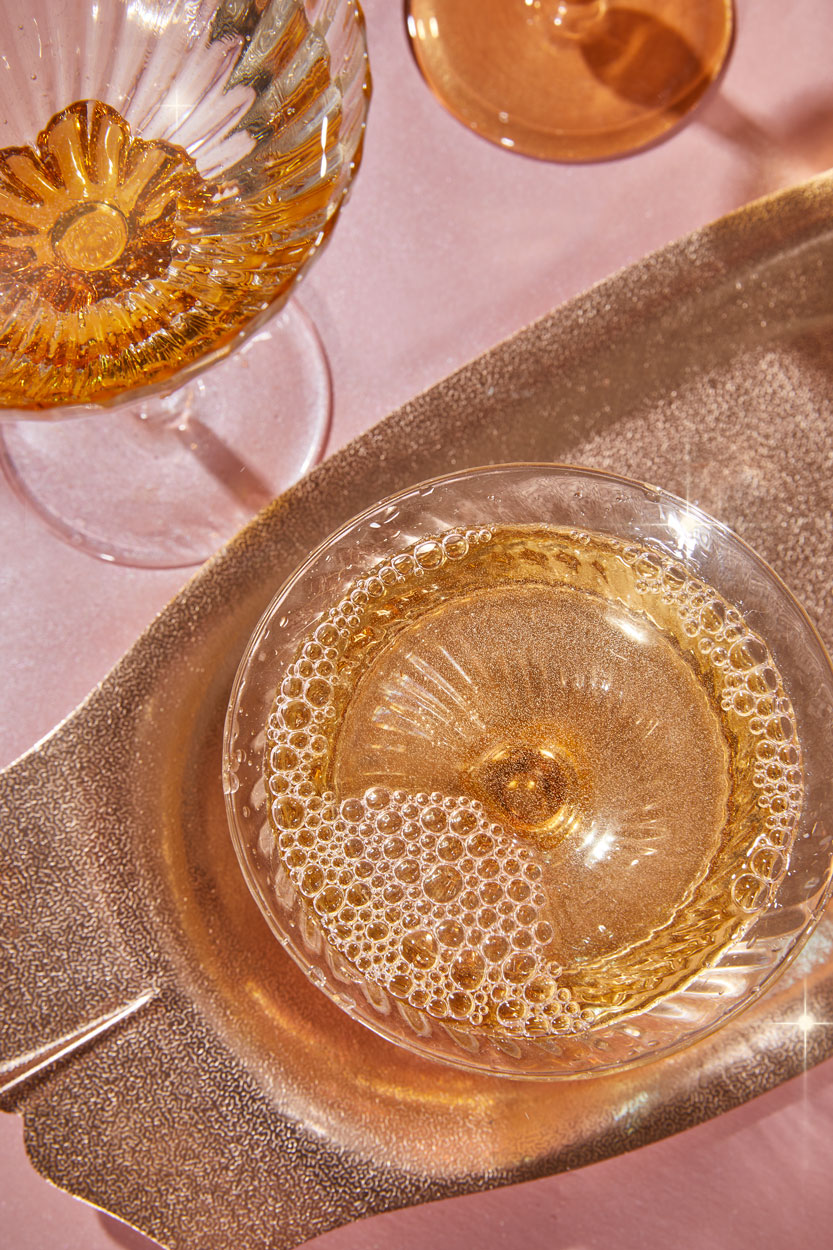 Orange Wine and Bubbles on gold tray