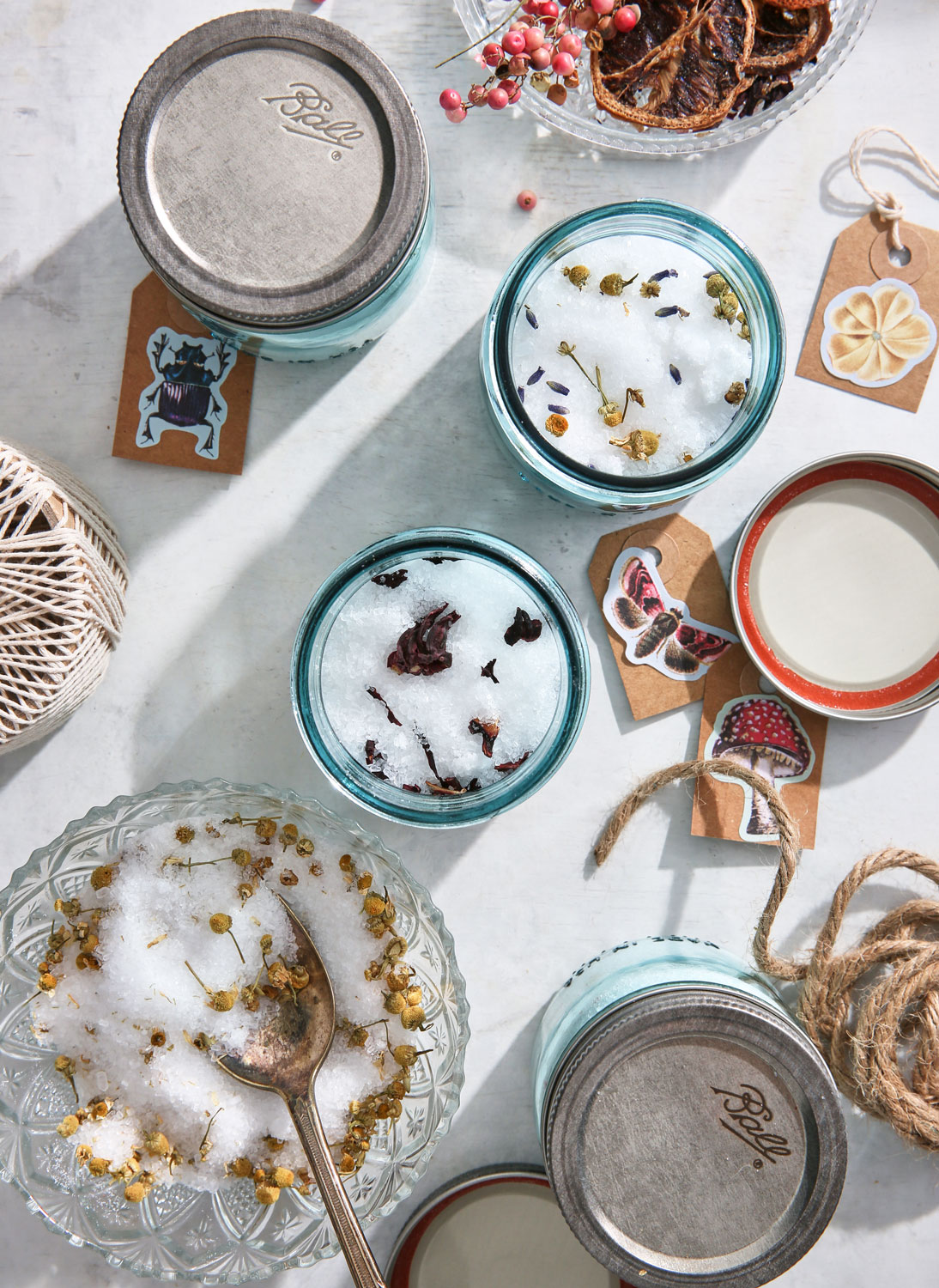 Blue ball jars with bath salts and botanicals overhead shot