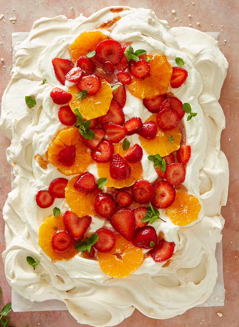 Pavlova with strawberries and orange