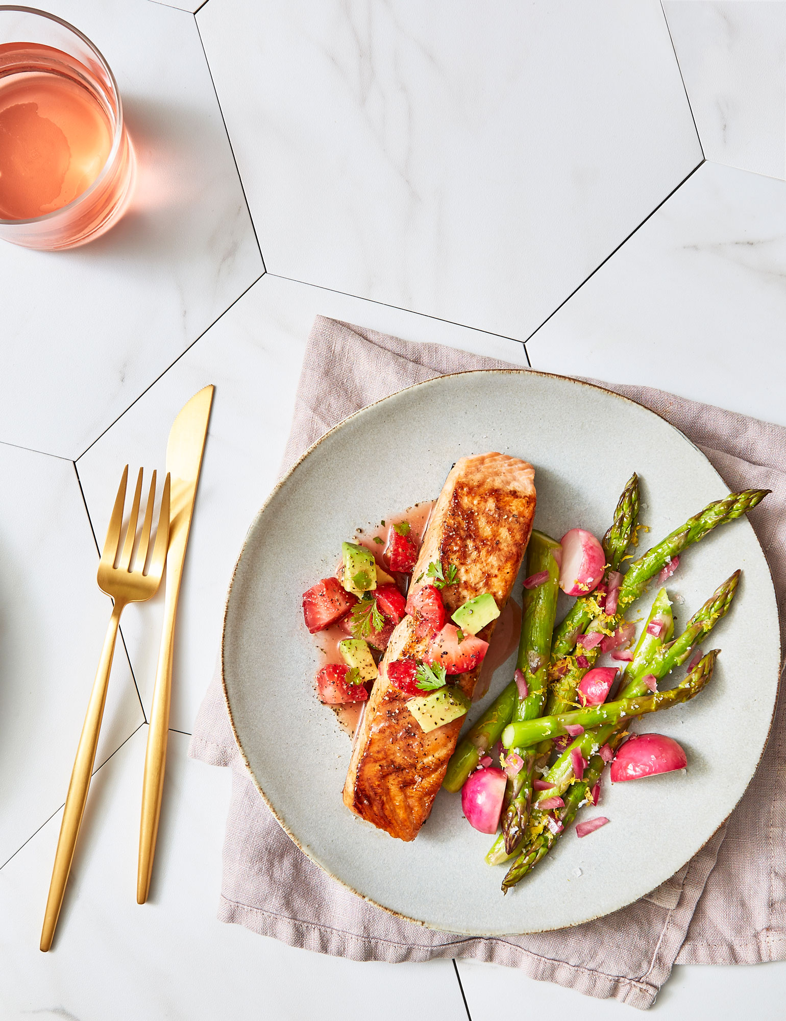 Salmon  with asparagus on white plate