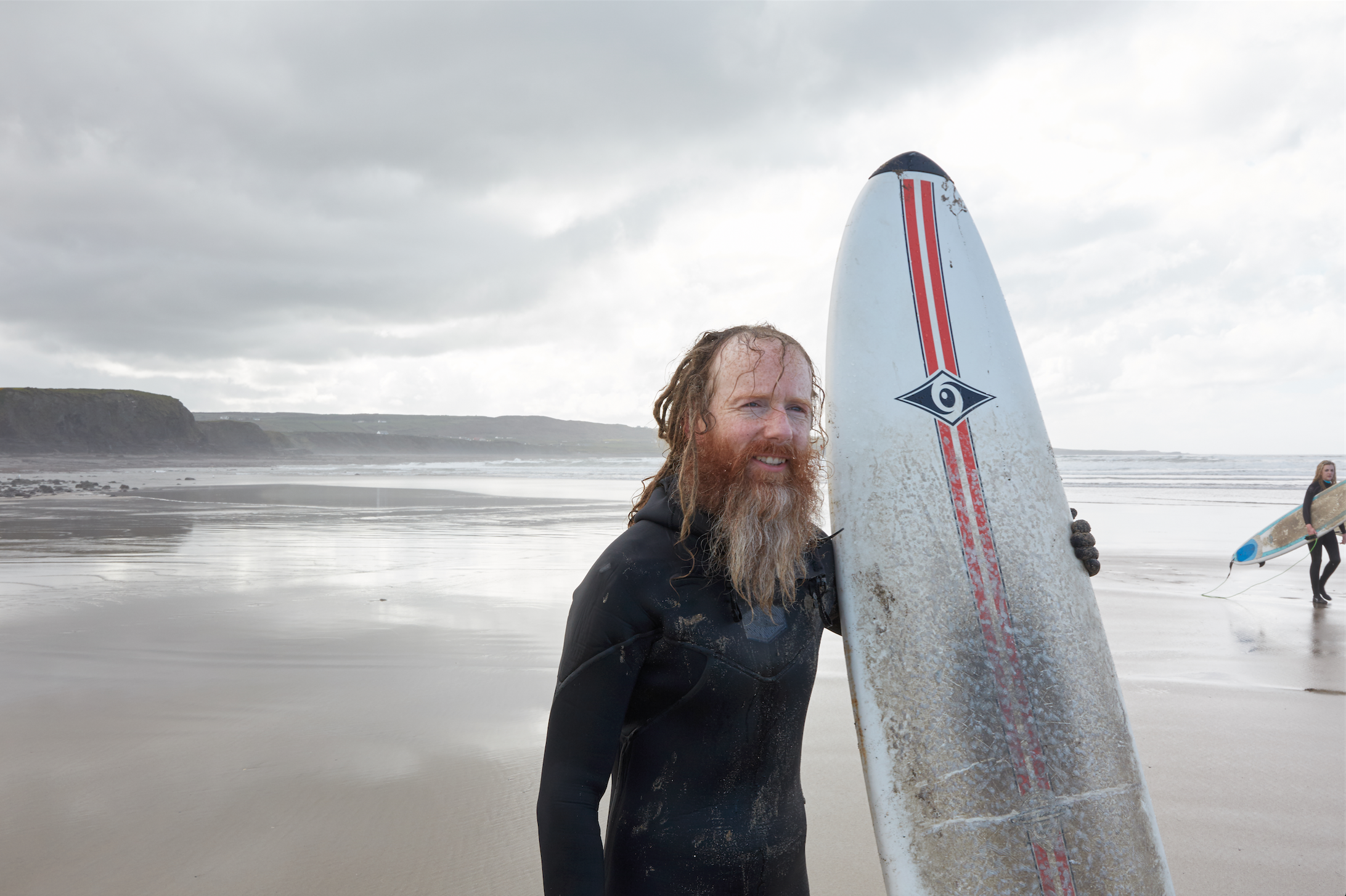 Surfer on a beach in Ireland