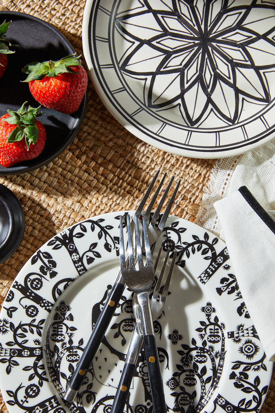 Black and white plates with strawberries